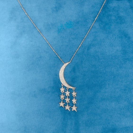 Silver crescent moon and stars pendant on a fine chain